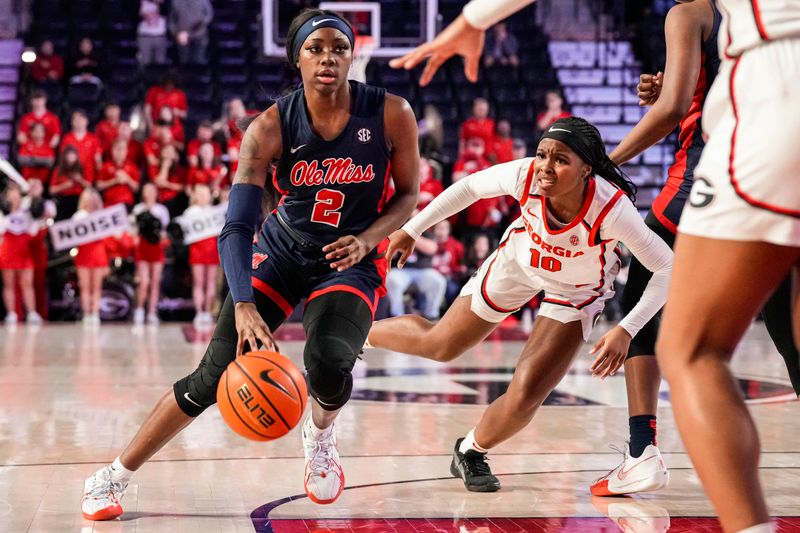 Jan 21, 2024; Athens, Georgia, USA; Ole Miss Rebels guard Marquesha Davis (2) dribbles past Georgia Bulldogs guard De'Mauri Flournoy (10) during the first half at Stegeman Coliseum. Mandatory Credit: Dale Zanine-USA TODAY Sports