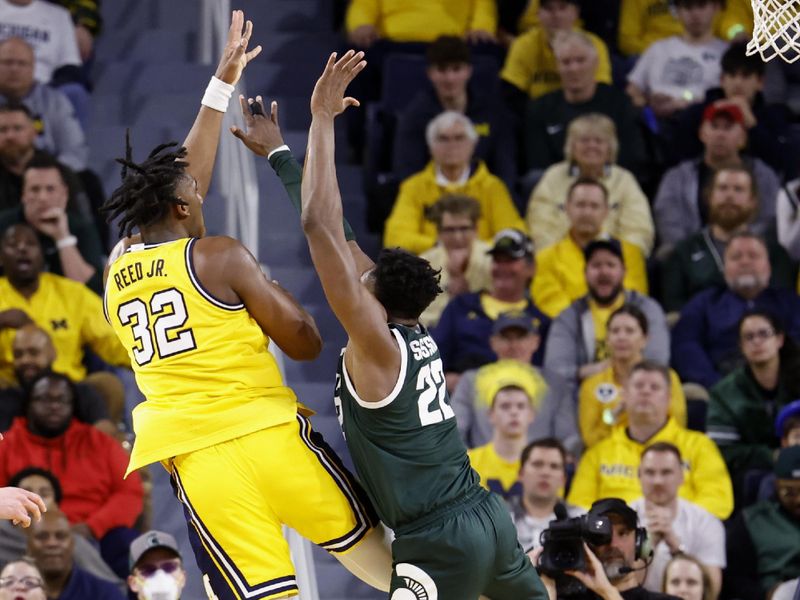 Feb 18, 2023; Ann Arbor, Michigan, USA;  Michigan Wolverines forward Tarris Reed Jr. (32) shoots the ball against Michigan State Spartans center Mady Sissoko (22) in the second half at Crisler Center. Mandatory Credit: Rick Osentoski-USA TODAY Sports