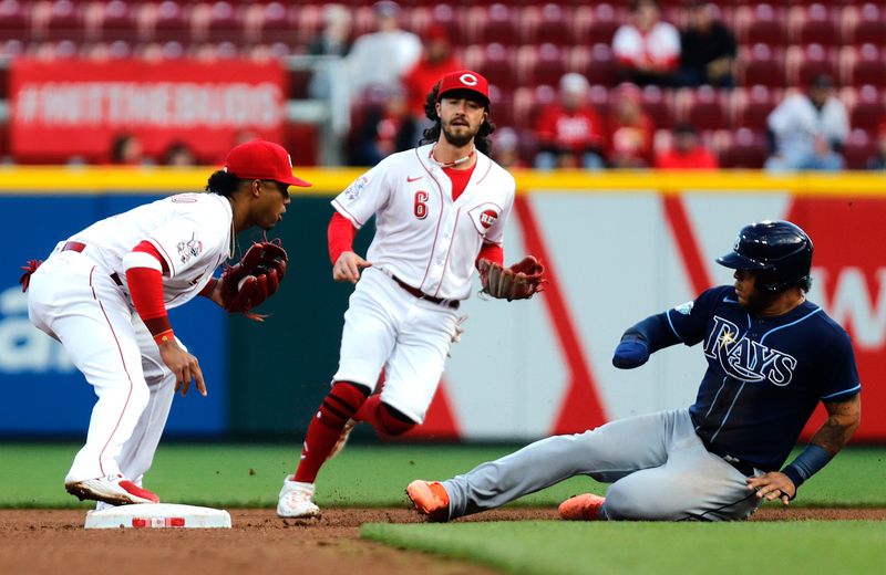 Apr 17, 2023; Cincinnati, Ohio, USA; Tampa Bay Rays Harold Ramirez (right) is forced out at second base against Cincinnati Reds shortstop Jose Barrero (left) during the fourth inning at Great American Ball Park. Mandatory Credit: David Kohl-USA TODAY Sports