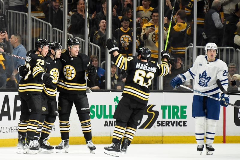 Apr 20, 2024; Boston, Massachusetts, USA; Boston Bruins left wing Jake DeBrusk (74) celebrates his goal with his teammates during the second period in game one of the first round of the 2024 Stanley Cup Playoffs against the Toronto Maple Leafs at TD Garden. Mandatory Credit: Bob DeChiara-USA TODAY Sports