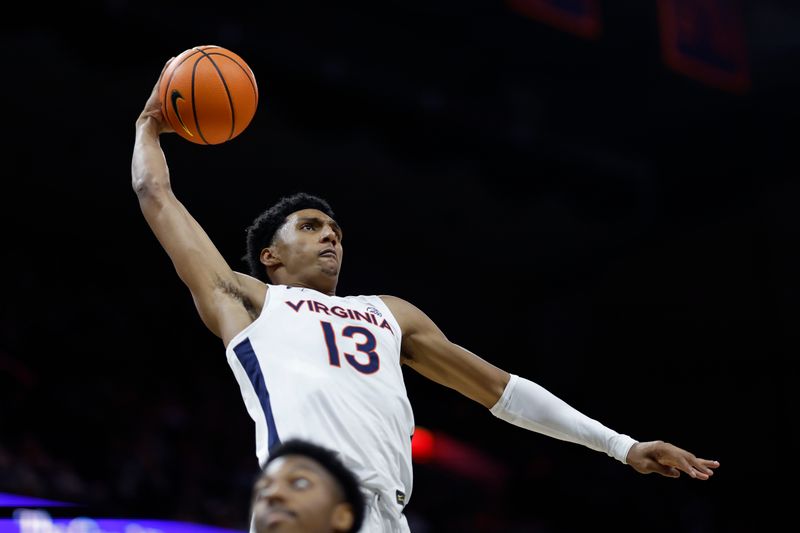 Nov 29, 2023; Charlottesville, Virginia, USA; Virginia Cavaliers guard Ryan Dunn (13) dunks the ball against the Texas A&M Aggies in the second half at John Paul Jones Arena. Mandatory Credit: Geoff Burke-USA TODAY Sports