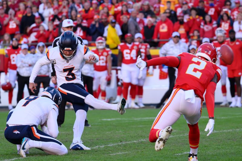 Denver Broncos place kicker Wil Lutz (3) tries a field goal attempt, which was blocked, and then recovered by Kansas City Chiefs cornerback Joshua Williams (2) during the second half of an NFL football game, Sunday, Nov. 10, 2024 in Kansas City, Mo. The Chiefs defeated the Broncos, 16-14. (AP Photo/Reed Hoffmann)