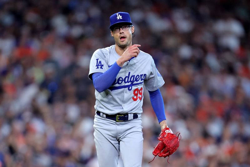 Jul 28, 2024; Houston, Texas, USA; Los Angeles Dodgers relief pitcher Joe Kelly (99) reactss after delivering a pitch against the Houston Astros during the eighth inning at Minute Maid Park. Mandatory Credit: Erik Williams-USA TODAY Sports