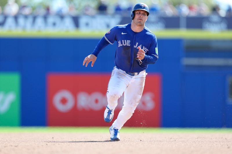 Mar 6, 2026; Dunedin, Florida, USA; Toronto Blue Jays center fielder Daulton Varsho (5) runs to third base against the Pittsburgh Pirates in the fourth inning during spring training at TD Ballpark. Mandatory Credit: Nathan Ray Seebeck-Imagn Images
