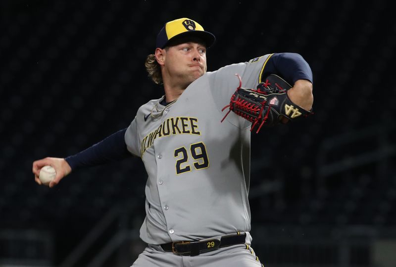 May 22, 2025; Pittsburgh, Pennsylvania, USA;  Milwaukee Brewers relief pitcher Trevor Megill (29) pitches against the Pittsburgh Pirates during the ninth inning at PNC Park. Mandatory Credit: Charles LeClaire-Imagn Images