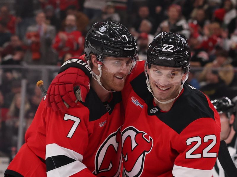 Jan 29, 2026; Newark, New Jersey, USA; New Jersey Devils defenseman Dougie Hamilton (7) and defenseman Brett Pesce (22) celebrate Hamilton’s goal against the Nashville Predators during the second period at Prudential Center. Mandatory Credit: Ed Mulholland-Imagn Images