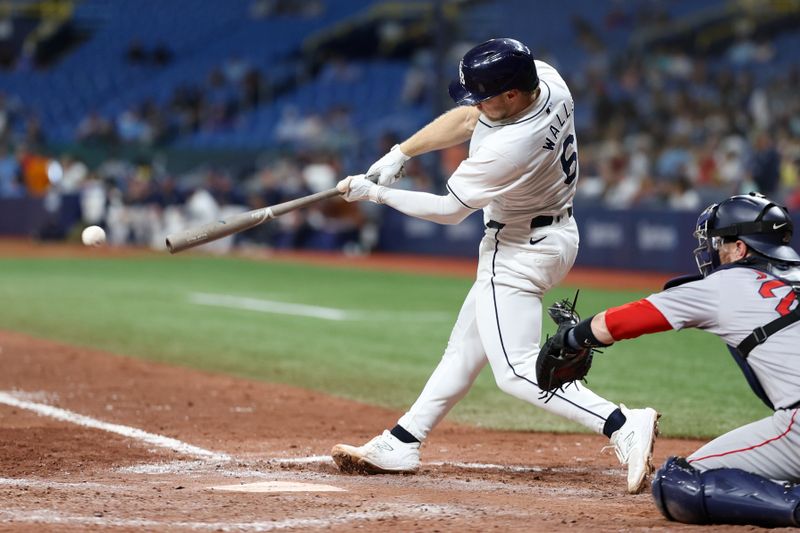 Sep 19, 2024; St. Petersburg, Florida, USA; Tampa Bay Rays shortstop Taylor Walls (6) singles against the Boston Red Sox in the seventh inning  at Tropicana Field. Mandatory Credit: Nathan Ray Seebeck-Imagn Images