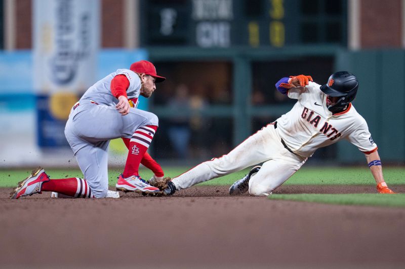 Sep 24, 2025; San Francisco, California, USA; San Francisco Giants shortstop Willy Adames (2) is caught stealing second base by St. Louis Cardinals second baseman Brendan Donovan (33) during the fifth inning at Oracle Park. Mandatory Credit: Neville E. Guard-Imagn Images
