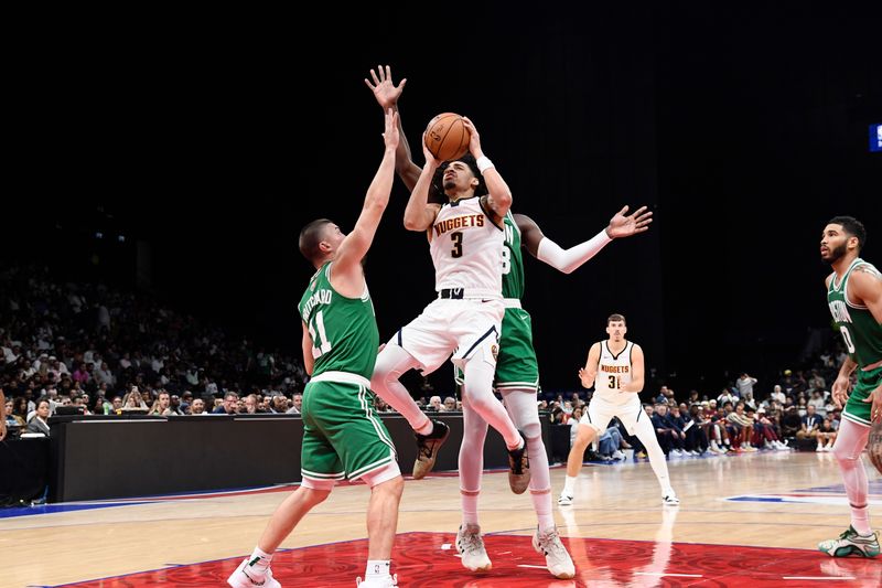 ABU DHABI, UAE - OCTOBER 6: Julian Strawther #3 of the Denver Nuggets drives to the basket during the game against the Boston Celtics during the 2024 Global Games on October 6, 2024 at the Etihad Arena in Abu Dhabi, United Arab Emirates. NOTE TO USER: User expressly acknowledges and agrees that, by downloading and/or using this Photograph, user is consenting to the terms and conditions of the Getty Images License Agreement. Mandatory Copyright Notice: Copyright 2024 NBAE (Photo by Brian Babineau/NBAE via Getty Images)