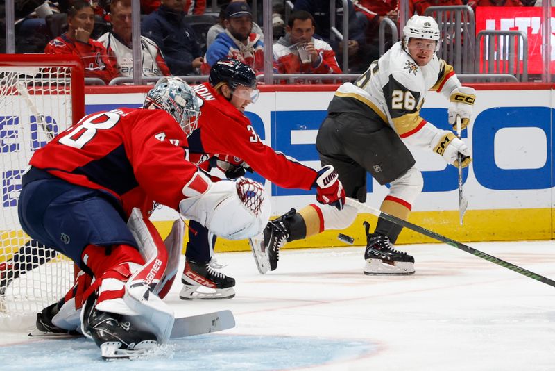 Oct 15, 2024; Washington, District of Columbia, USA; Vegas Golden Knights right wing Alexander Holtz (26) flips the puck towards Washington Capitals goaltender Logan Thompson (48) in the second period at Capital One Arena. Mandatory Credit: Geoff Burke-Imagn Images