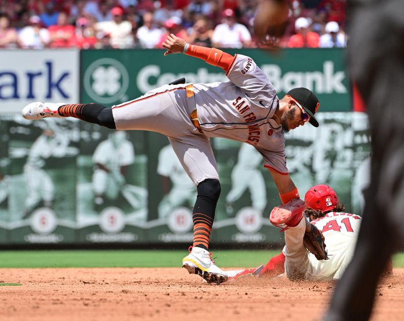 Jun 22, 2024; St. Louis, Missouri, USA;  San Francisco Giants second baseman Thairo Estrada tries to put the tag on St. Louis Cardinals outfielder Alec Burleson as he safely steals second base in the third inning at Busch Stadium. Mandatory Credit: Tim Vizer-USA TODAY Sports