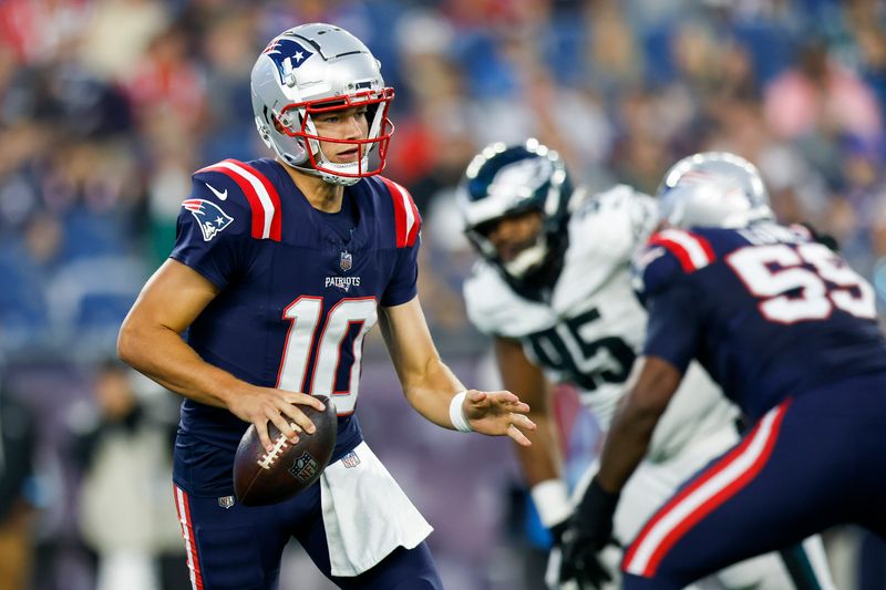 New England Patriots quarterback Drake Maye (10) scrambles out of the pocket during the first half of an NFL football game against the Philadelphia Eagles on Thursday, Aug. 15, 2024, in Foxborough, Mass. (AP Photo/Greg M. Cooper)