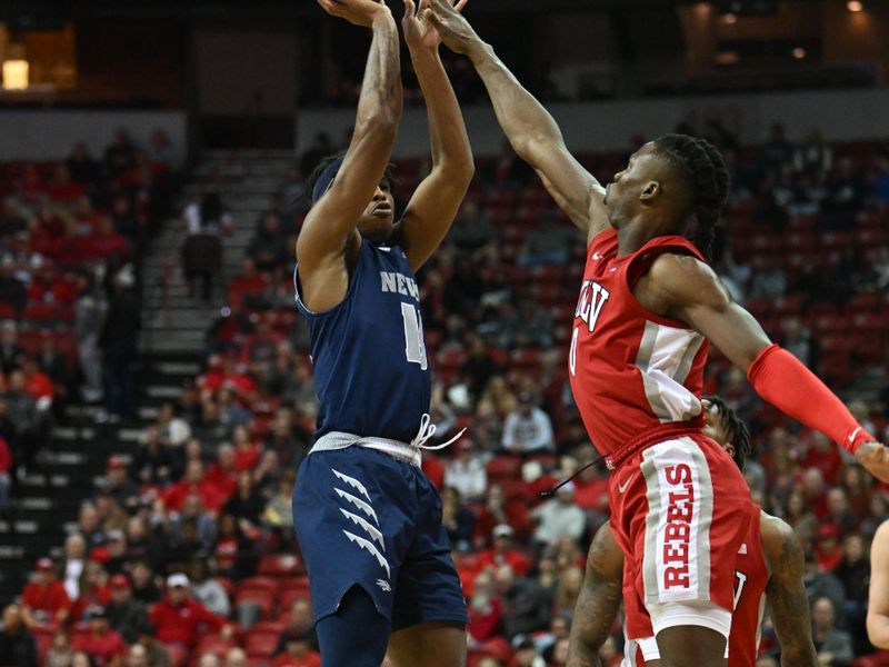 Jan 28, 2023; Las Vegas, Nevada, USA; Nevada Wolf Pack guard Kenan Blackshear (13) takes a shot against UNLV Runnin' Rebels guard Justin Webster (2) in the first half at Thomas & Mack Center. Mandatory Credit: Candice Ward-USA TODAY Sports