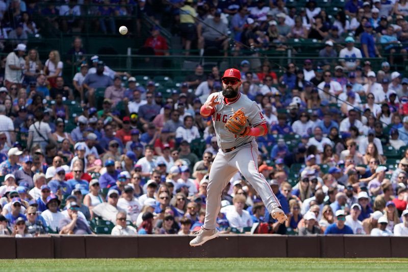 Jul 6, 2024; Chicago, Illinois, USA; Los Angeles Angels third baseman Luis Guillorme (15) makes a play on Chicago Cubs second baseman Nico Hoerner (not pictured) during the sixth inning at Wrigley Field. Mandatory Credit: David Banks-USA TODAY Sports