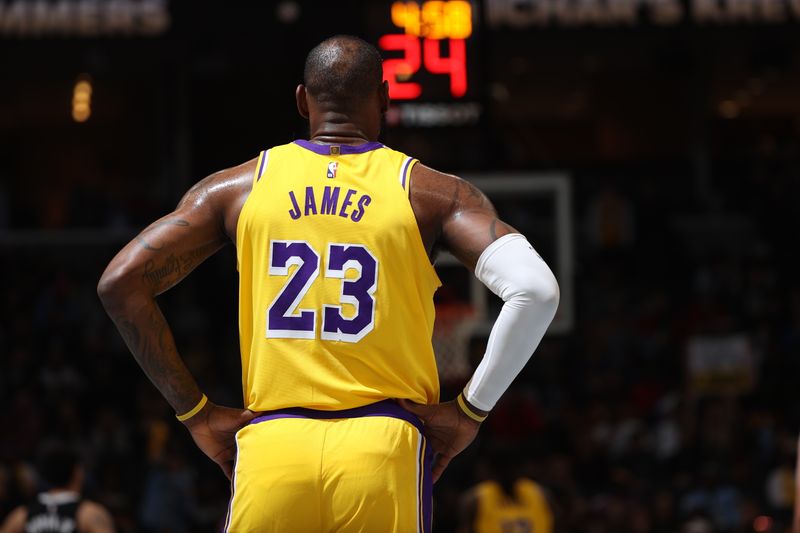 MEMPHIS, TN - MARCH 27: LeBron James #23 of the Los Angeles Lakers looks on during the game against the Memphis Grizzlies on March 27, 2024 at FedExForum in Memphis, Tennessee. NOTE TO USER: User expressly acknowledges and agrees that, by downloading and or using this photograph, User is consenting to the terms and conditions of the Getty Images License Agreement. Mandatory Copyright Notice: Copyright 2024 NBAE (Photo by Joe Murphy/NBAE via Getty Images)