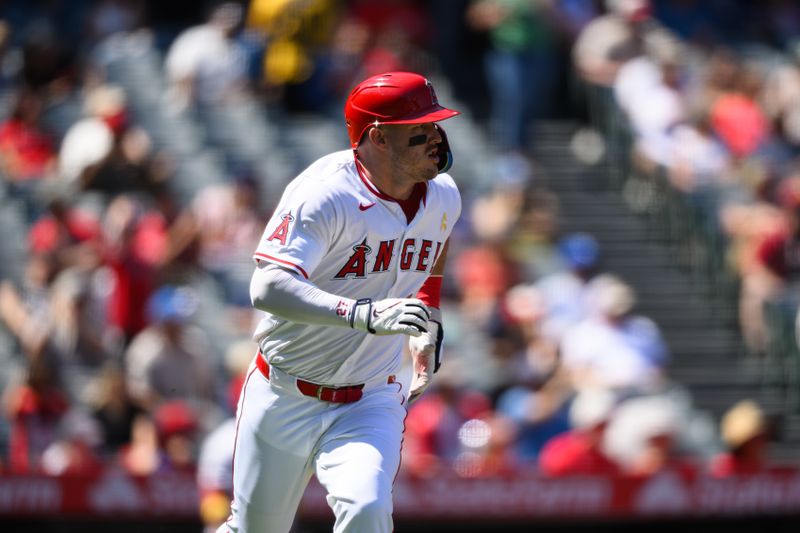 Sep 7, 2025; Anaheim, California, USA; Los Angeles Angels designated hitter Mike Trout (27) runs after hitting a double against the Athletics during the third inning at Angel Stadium. Mandatory Credit: William Liang-Imagn Images