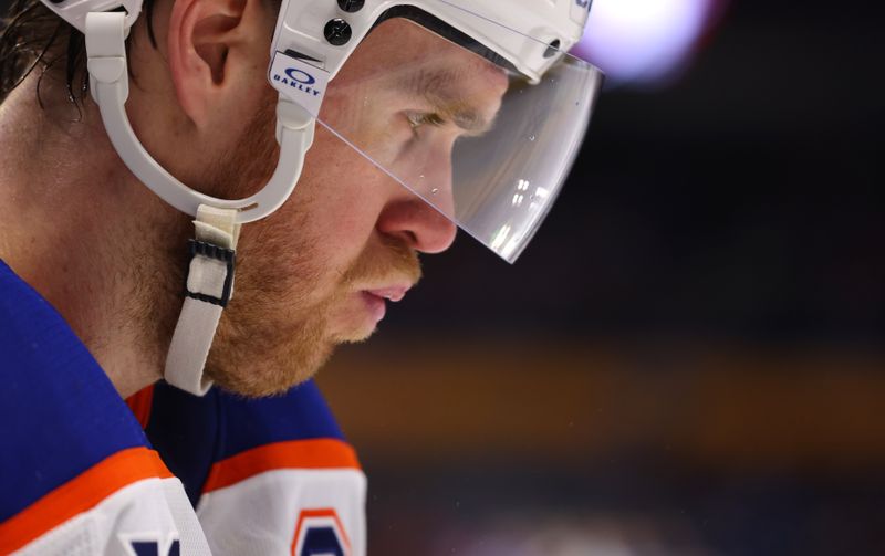 Mar 10, 2025; Buffalo, New York, USA;  Edmonton Oilers center Connor McDavid (97) during a stoppage in play against the Buffalo Sabres at KeyBank Center. Mandatory Credit: Timothy T. Ludwig-Imagn Images