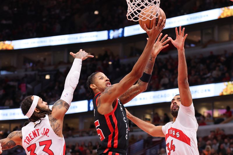 CHICAGO, ILLINOIS - JANUARY 30: Dalen Terry #25 of the Chicago Bulls goes up for a layup against the Toronto Raptors during the first half at the United Center on January 30, 2024 in Chicago, Illinois. NOTE TO USER: User expressly acknowledges and agrees that, by downloading and or using this photograph, User is consenting to the terms and conditions of the Getty Images License Agreement.  (Photo by Michael Reaves/Getty Images)