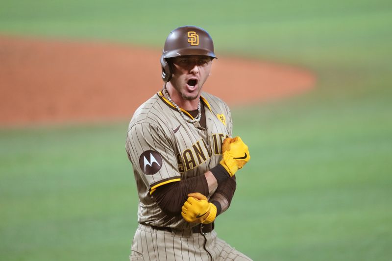 Aug 10, 2024; Miami, Florida, USA;  San Diego Padres center fielder Jackson Merrill (3) celebrates a two-run home run to tie the game in the eighth inning against the Miami Marlins at loanDepot Park. Mandatory Credit: Jim Rassol-USA TODAY Sports