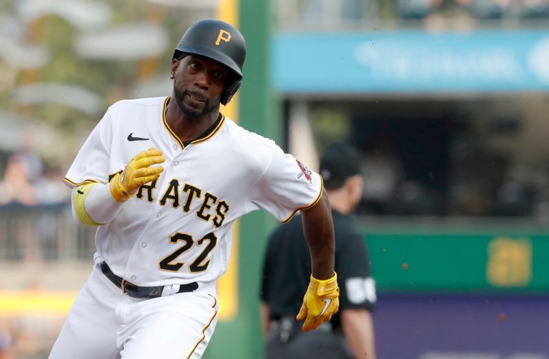 May 22, 2023; Pittsburgh, Pennsylvania, USA;  Pittsburgh Pirates designated hitter Andrew McCutchen (22) runs from first to third against the Texas Rangers during the first inning at PNC Park. Mandatory Credit: Charles LeClaire-USA TODAY Sports