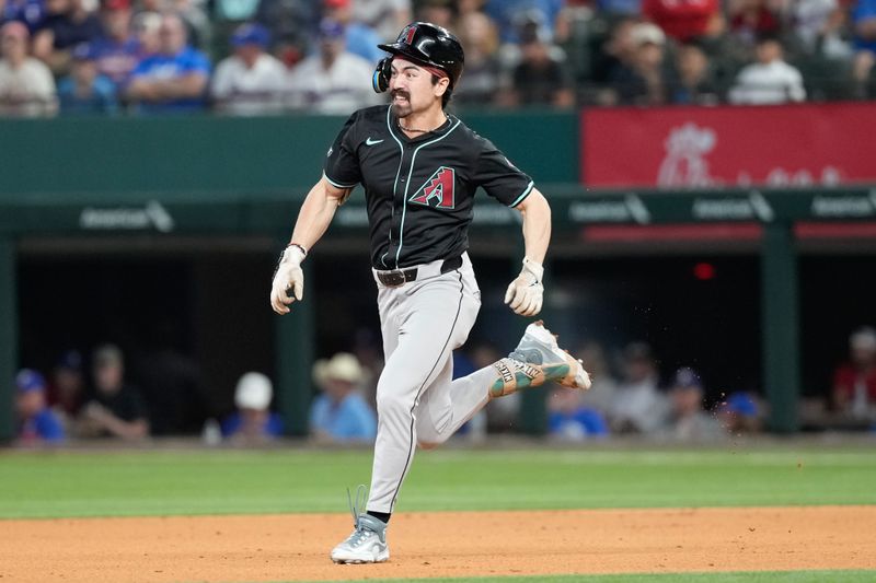 May 29, 2024; Arlington, Texas, USA; Arizona Diamondbacks center fielder Corbin Carroll (7) runs for a double against the Texas Rangers during the third inning at Globe Life Field. Mandatory Credit: Jim Cowsert-USA TODAY Sports