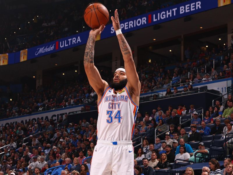 OKLAHOMA CITY, OK - FEBRUARY 23: Kenrich Williams #34 of the Oklahoma City Thunder three point basket during the game against the Washington Wizards on February 23, 2024 at Paycom Arena in Oklahoma City, Oklahoma. NOTE TO USER: User expressly acknowledges and agrees that, by downloading and or using this photograph, User is consenting to the terms and conditions of the Getty Images License Agreement. Mandatory Copyright Notice: Copyright 2024 NBAE (Photo by Zach Beeker/NBAE via Getty Images)