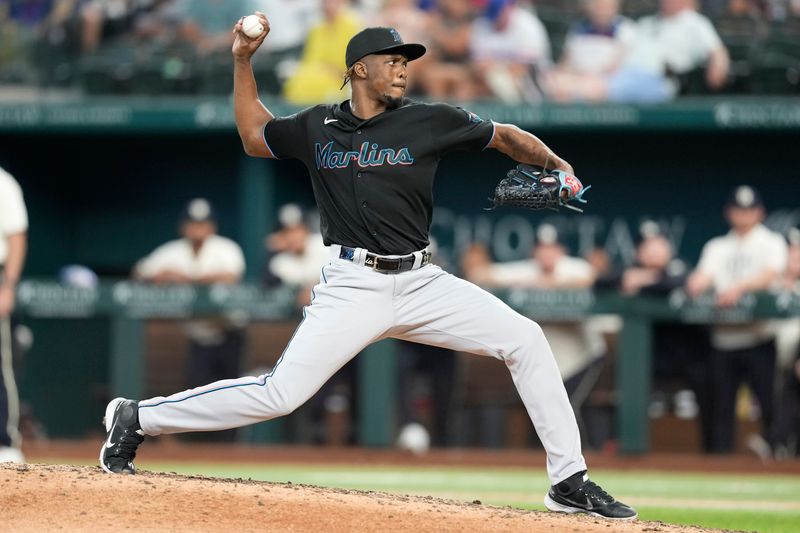 Aug 5, 2023; Arlington, Texas, USA; Miami Marlins relief pitcher Huascar Brazoban (31) delivers to the Texas Rangers during the eighth inning at Globe Life Field. Mandatory Credit: Jim Cowsert-USA TODAY Sports