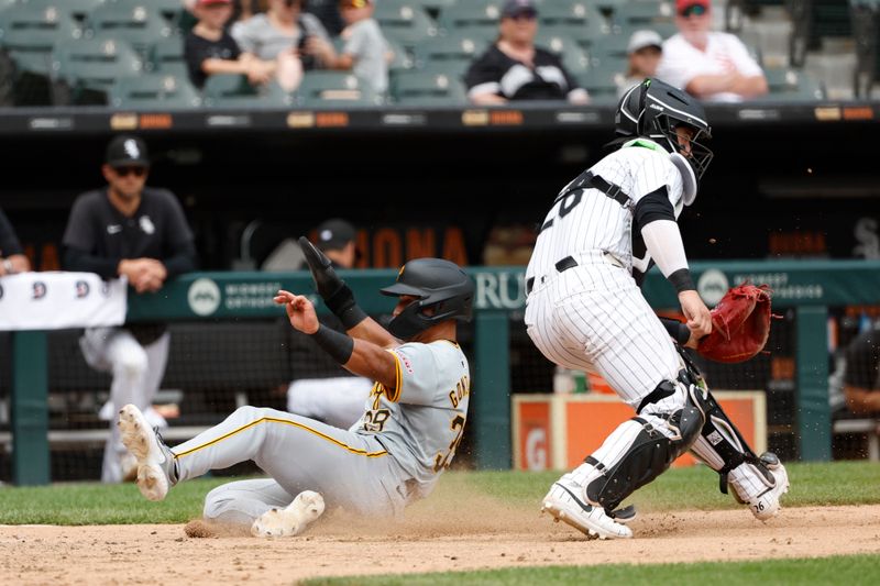 Jul 14, 2024; Chicago, Illinois, USA; Pittsburgh Pirates second baseman Nick Gonzales (39) scores against the Chicago White Sox during the seventh inning at Guaranteed Rate Field. Mandatory Credit: Kamil Krzaczynski-USA TODAY Sports