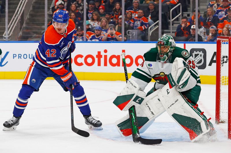 Nov 21, 2024; Edmonton, Alberta, CAN; Edmonton Oilers forward Kasperi Kapanen (42) looks for a pass in front of Minnesota Wild goaltender Marc-Andre Fleury (29) during the third period at Rogers Place. Mandatory Credit: Perry Nelson-Imagn Images