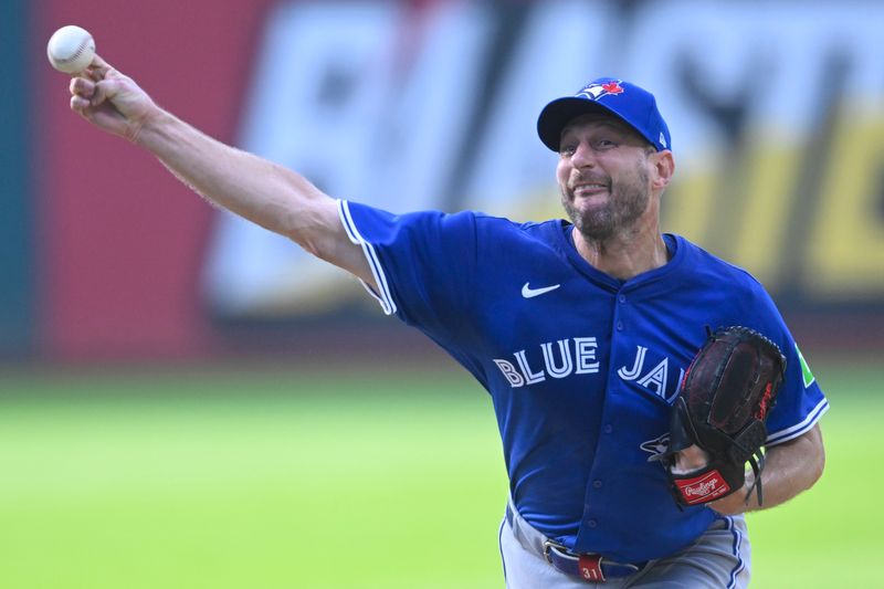 Jun 25, 2025; Cleveland, Ohio, USA; Toronto Blue Jays starting pitcher Max Scherzer (31) delivers a pitch in the first inning against the Cleveland Guardians at Progressive Field. Mandatory Credit: David Richard-Imagn Images