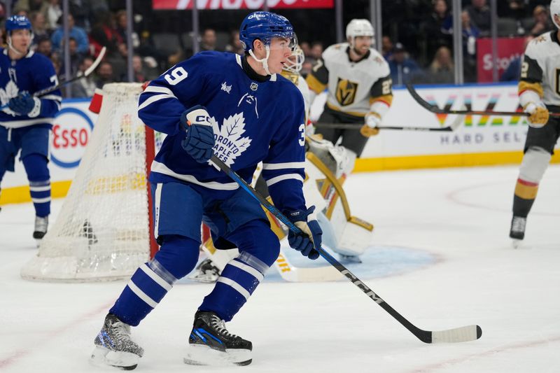 Nov 20, 2024; Toronto, Ontario, CAN; Toronto Maple Leafs forward Fraser Minten (39) skates against the Vegas Golden Knights during the first period at Scotiabank Arena. Mandatory Credit: John E. Sokolowski-Imagn Images