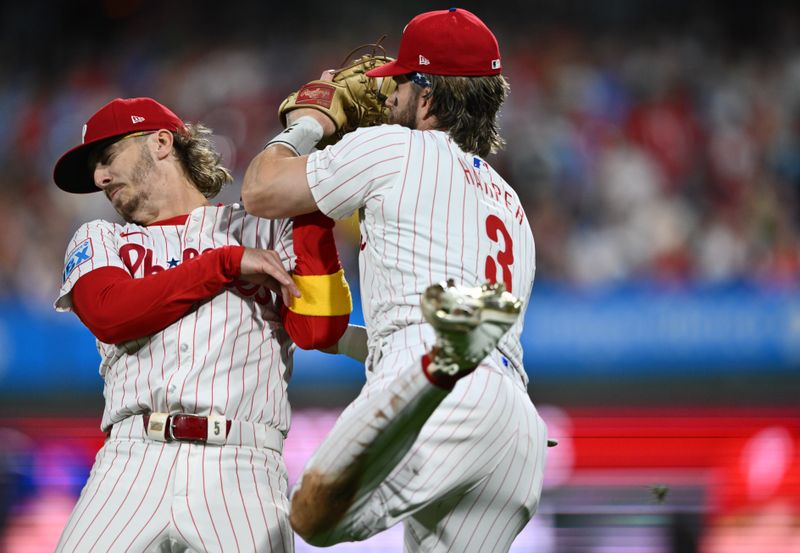 Sep 25, 2024; Philadelphia, Pennsylvania, USA; Philadelphia Phillies first baseman Bryce Harper (3) collides with second baseman Bryson Stott (5) as he fields a fly ball against the Chicago Cubs in the seventh inning at Citizens Bank Park. Mandatory Credit: Kyle Ross-Imagn Images