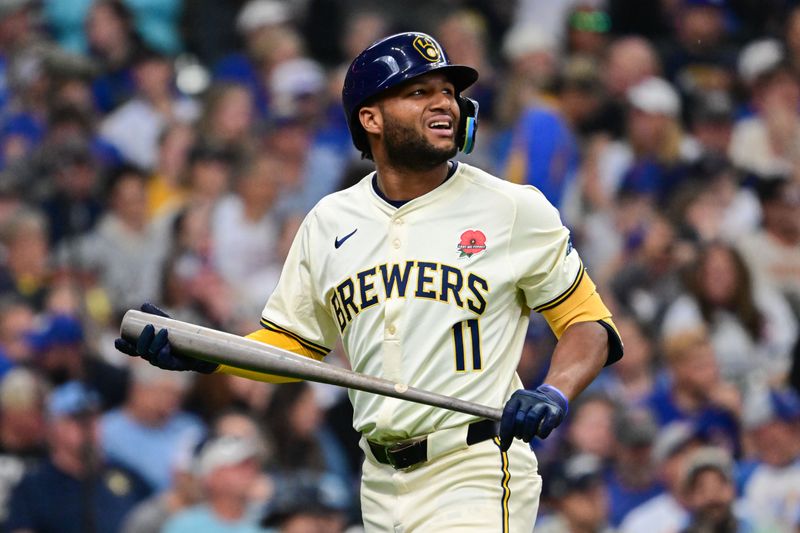 May 27, 2024; Milwaukee, Wisconsin, USA; Milwaukee Brewers right fielder Jackson Chourio (11) reacts after striking out in the fourth inning against the Chicago Cubs at American Family Field. Mandatory Credit: Benny Sieu-USA TODAY Sports