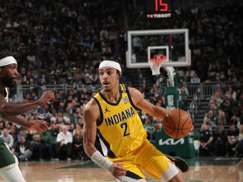 MILWAUKEE, WI - APRIL 21: Andrew Nembhard #2 of the Indiana Pacers dribbles the ball during the game against the Milwaukee Bucks during Round 1 Game 1 of the 2024 NBA Playoffs on April 21, 2024 at the Fiserv Forum Center in Milwaukee, Wisconsin. NOTE TO USER: User expressly acknowledges and agrees that, by downloading and or using this Photograph, user is consenting to the terms and conditions of the Getty Images License Agreement. Mandatory Copyright Notice: Copyright 2024 NBAE (Photo by Gary Dineen/NBAE via Getty Images).