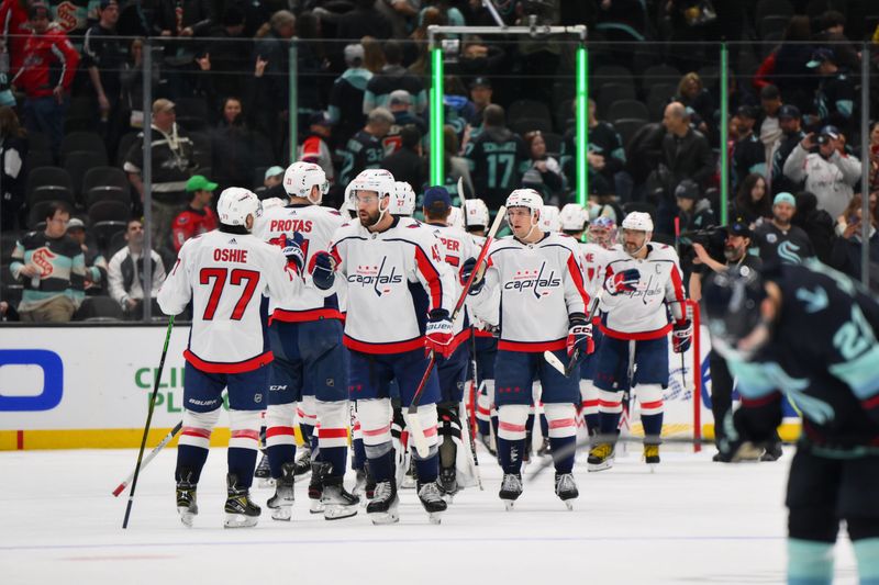 Mar 14, 2024; Seattle, Washington, USA; The Washington Capitals celebrate after defeating the Seattle Kraken at Climate Pledge Arena. Mandatory Credit: Steven Bisig-USA TODAY Sports