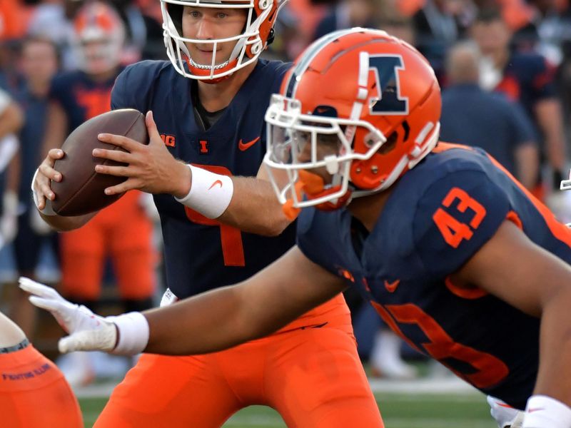 Aug 27, 2022; Champaign, Illinois, USA;  Illinois Fighting Illini quarterback Artur Sitkowski (9) takes the ball on the snap the second half against Wyoming at Memorial Stadium. Mandatory Credit: Ron Johnson-USA TODAY Sports