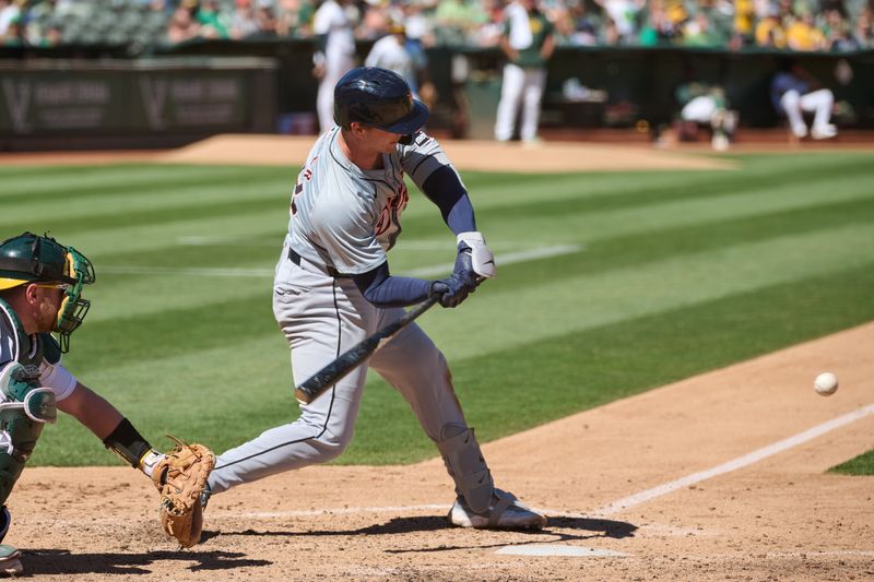 Sep 7, 2024; Oakland, California, USA; Detroit Tigers catcher Dillon Dingler (38) hits into an RBI fielders choice against the Oakland Athletics during the seventh inning at Oakland-Alameda County Coliseum. Mandatory Credit: Robert Edwards-Imagn Images