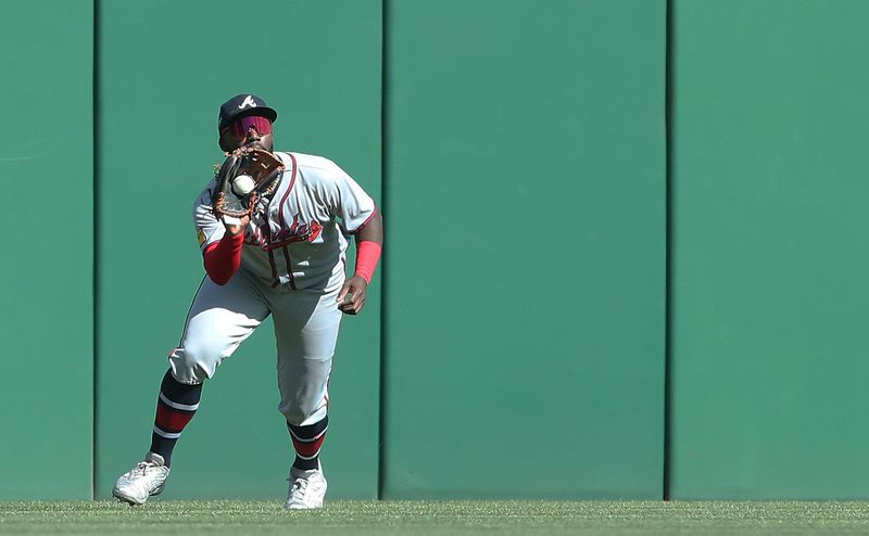 May 10, 2025; Pittsburgh, Pennsylvania, USA;  Atlanta Braves center fielder Michael Harris II (23) makes a catch for an out against Pittsburgh Pirates right fielder Bryan Reynolds (not pictured) during the third inning at PNC Park. Mandatory Credit: Charles LeClaire-Imagn Images