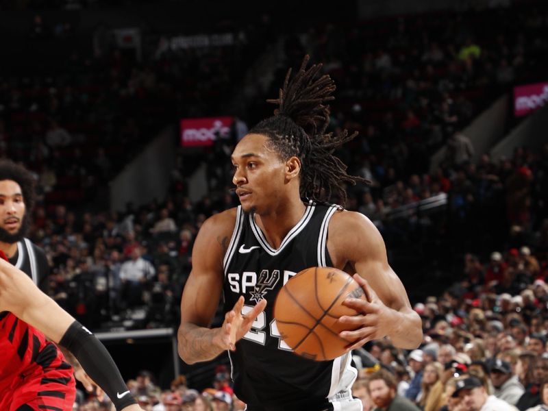 PORTLAND, OR - DECEMBER 13: Devin Vassell #24 of the San Antonio Spurs drives to the basket during the game against the Portland Trail Blazers on December 13, 2024 at the Moda Center Arena in Portland, Oregon. NOTE TO USER: User expressly acknowledges and agrees that, by downloading and or using this photograph, user is consenting to the terms and conditions of the Getty Images License Agreement. Mandatory Copyright Notice: Copyright 2024 NBAE (Photo by Cameron Browne/NBAE via Getty Images)