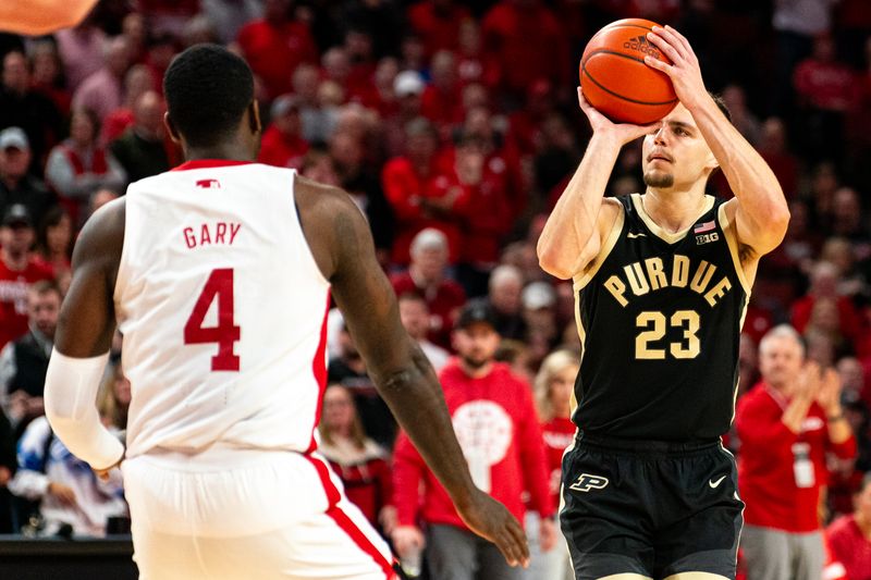 Jan 9, 2024; Lincoln, Nebraska, USA; Purdue Boilermakers forward Camden Heide (23) shoots a 3-pointer against Nebraska Cornhuskers forward Juwan Gary (4) during the second half at Pinnacle Bank Arena. Mandatory Credit: Dylan Widger-USA TODAY Sports