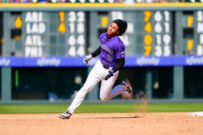 Aug 31, 2025; Denver, Colorado, USA; Colorado Rockies second basement Ryan Ritter (8) heads home to score the winning run in the ninth inning against the Chicago Cubs at Coors Field. Mandatory Credit: Ron Chenoy-Imagn Images