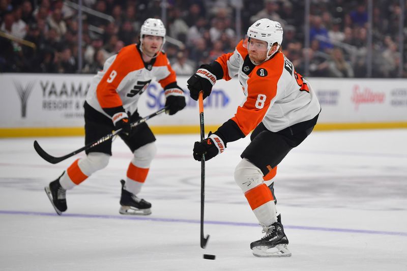 Mar 19, 2026; Los Angeles, California, USA; Philadelphia Flyers defenseman Cam York (8) shoots on goal against the Los Angeles Kings during the first period at Crypto.com Arena. Mandatory Credit: Gary A. Vasquez-Imagn Images