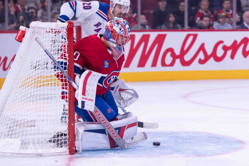 Oct 22, 2024; Ottawa, Ontario, CAN; Montreal Canadiens goalie Cayden Primeau (30) makes a save in front of New York Rangers left wing Chris Kreider (20) in the third period at the Bell Centre. Mandatory Credit: Marc DesRosiers-Imagn Images