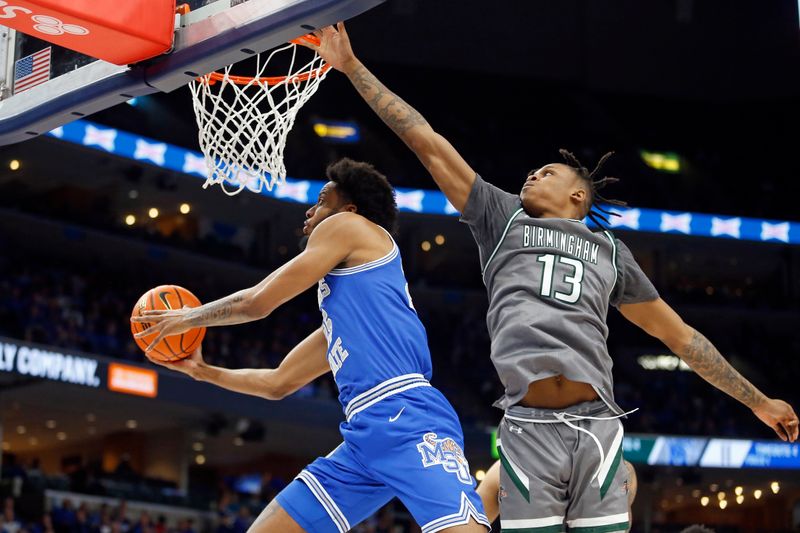 Mar 3, 2024; Memphis, Tennessee, USA; Memphis Tigers guard Jayden Hardaway (25) drives to the basket as UAB Blazers forward Christian Coleman (13) defends during the first half at FedExForum. Mandatory Credit: Petre Thomas-USA TODAY Sports