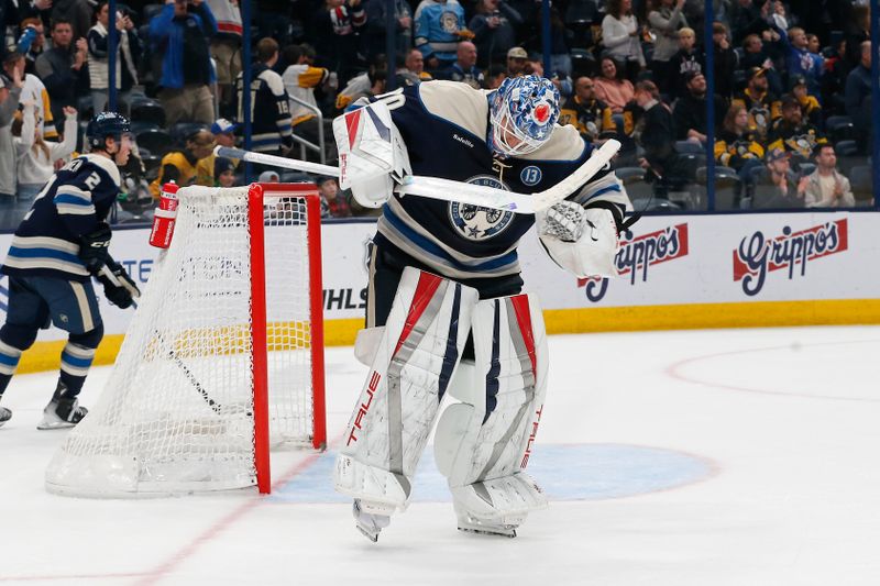 Nov 15, 2024; Columbus, Ohio, USA; Columbus Blue Jackets goalie Elvis Merzlikins (90) celebrates the win over Pittsburgh Penguins at the end of the third period at Nationwide Arena. Mandatory Credit: Russell LaBounty-Imagn Images