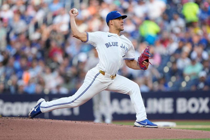 Jun 27, 2024; Toronto, Ontario, CAN; Toronto Blue Jays starting pitcher Jose Berrios (17) pitches to the New York Yankees during the first inning at Rogers Centre. Mandatory Credit: John E. Sokolowski-USA TODAY Sports