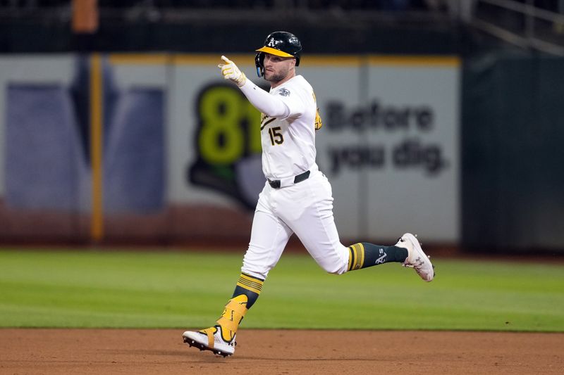 Sep 6, 2024; Oakland, California, USA; Oakland Athletics left fielder Seth Brown (15) gestures while rounding the bases after hitting a home run against the Detroit Tigers during the eleventh inning at Oakland-Alameda County Coliseum. Mandatory Credit: Darren Yamashita-Imagn Images