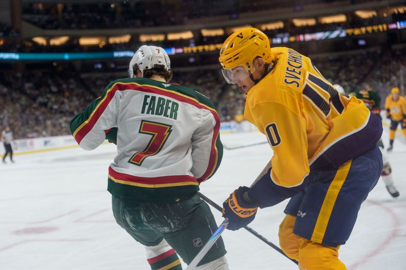 Nov 4, 2025; Saint Paul, Minnesota, USA; Nashville Predators center Fedor Svechkov (40) is checked by Minnesota Wild defenseman Brock Faber (7) in the first period at Grand Casino Arena. Mandatory Credit: Matt Blewett-Imagn Images