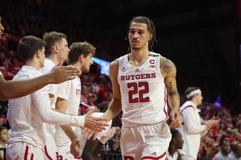 Nov 26, 2022; Piscataway, New Jersey, USA; Rutgers Scarlet Knights guard Caleb McConnell (22) slaps hands with teammates after being subbed out during the first half against the Central Connecticut State Blue Devils at Jersey Mike's Arena. Mandatory Credit: Vincent Carchietta-USA TODAY Sports