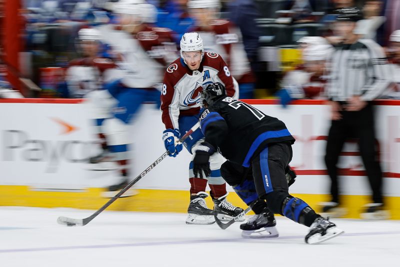 Feb 24, 2024; Denver, Colorado, USA; Colorado Avalanche defenseman Cale Makar (8) controls the puck as Toronto Maple Leafs defenseman TJ Brodie (78) defends in the second period at Ball Arena. Mandatory Credit: Isaiah J. Downing-USA TODAY Sports